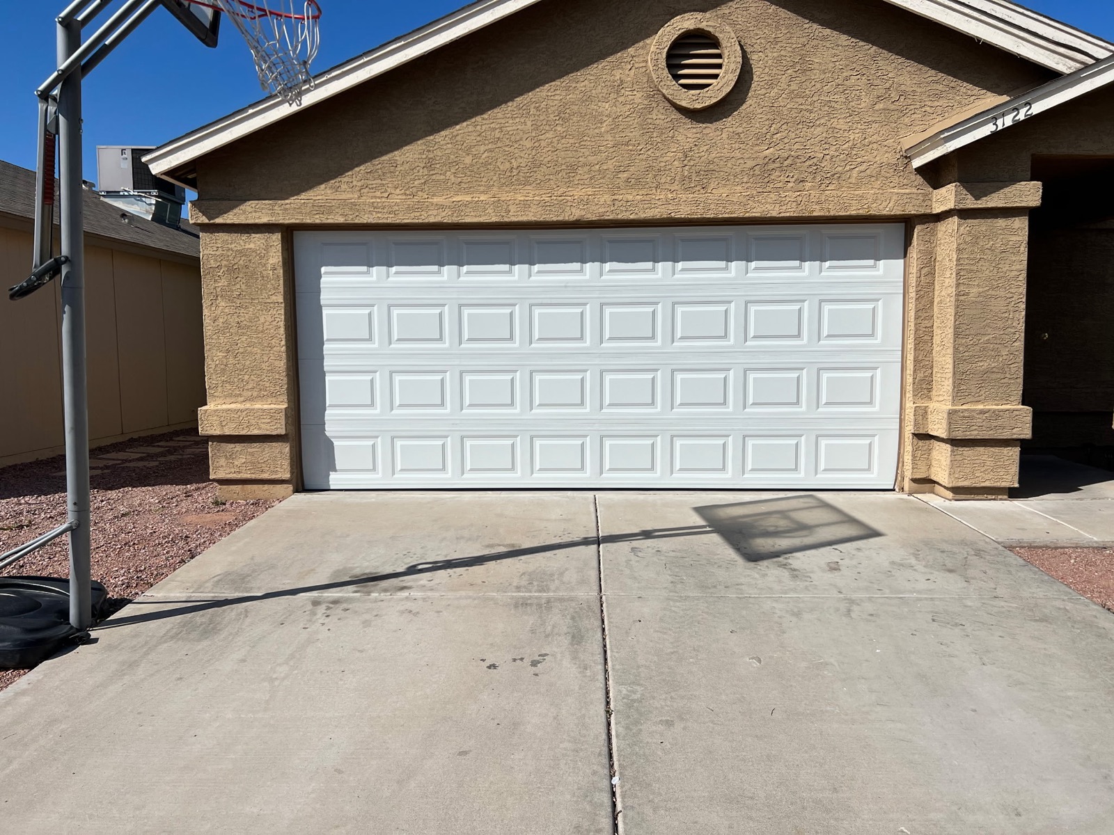 White double garage door installed on Arizona home