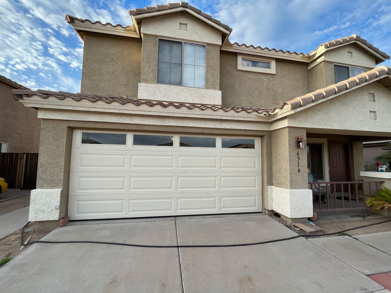 White double garage door on two-story Phoenix home